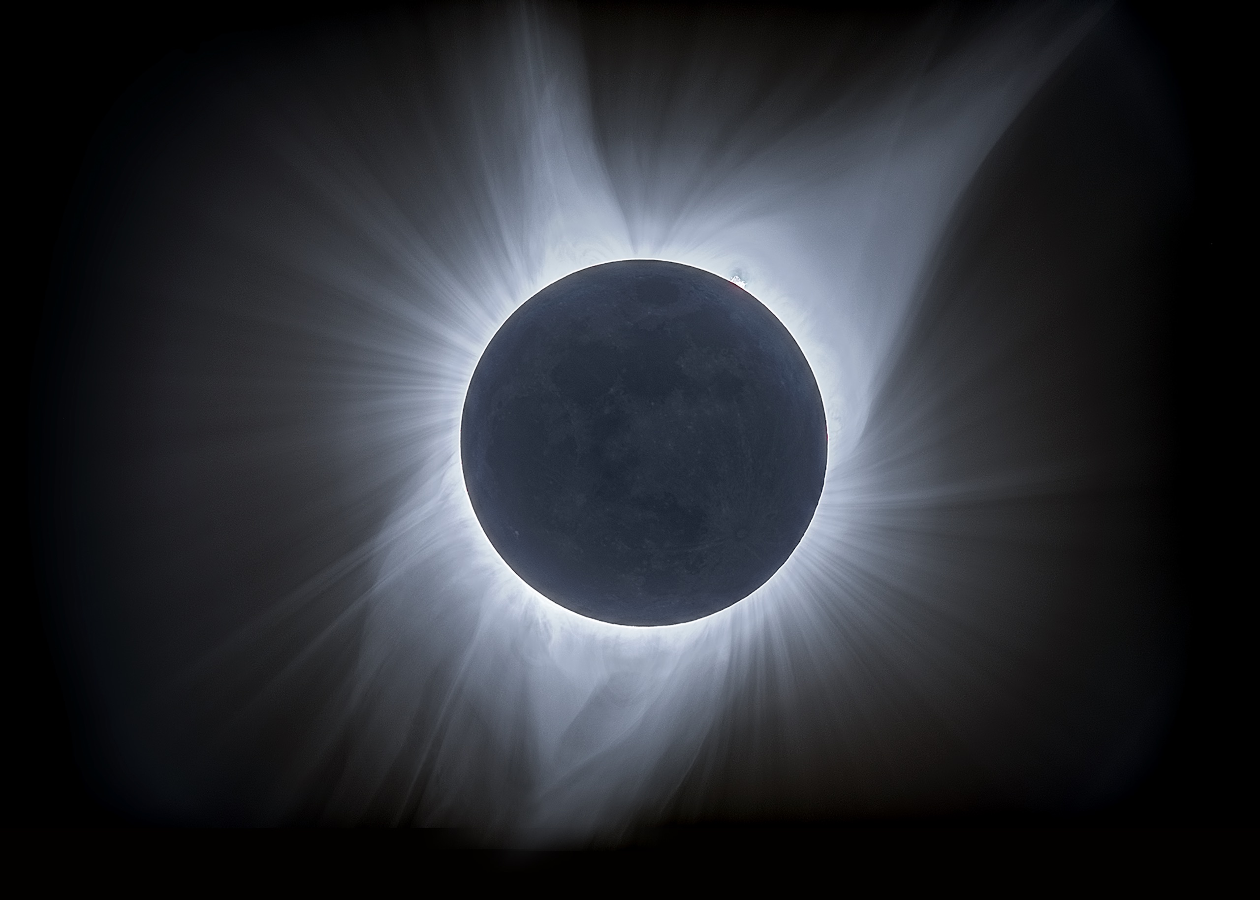 The corona is made of hot, glowing plasma flying off of the Sun. It can only be seen when the Sun is completely eclipsed. Credit: Blake Estes